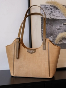 Khaki straw tote bag with olive green handles and Jingpin label on front