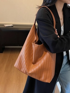 Retro caramel woven tote bag with wide leather texture for daily office commuting