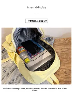 Vue intérieure du sac à dos jaune montrant la doublure rayée pour magazines A4 et plus