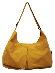 Mustard yellow nylon messenger bag with double front pockets and adjustable shoulder strap