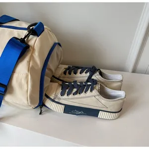 Travel bag side detail showing functional wet dry separation shoe compartment with canvas shoes