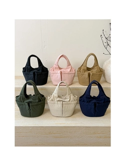 Quilted multi-pocket bucket bags in six colors displayed on white stone steps