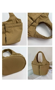 Detail view of khaki padded tote bag showing dual front pockets and oval base shape
