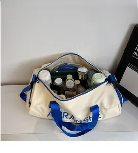 Top view of large travel duffel bag showing spacious interior with water bottles and cosmetics