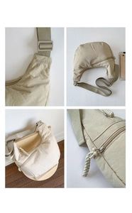 Macro detail of high-density beige nylon fabric and premium Wisdora logo embroidery