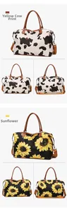 Detail view of large travel bags in cow print and sunflower patterns with leather handles
