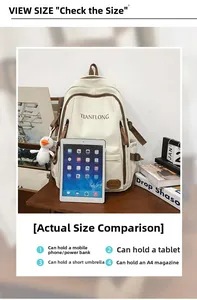 Detail view of large beige backpack showing capacity for A4 magazines and gadgets on desk
