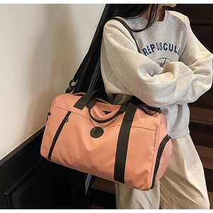 Pink large-capacity gym bag with waterproof nylon fabric and adjustable shoulder strap