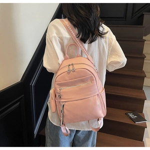 Pink lychee texture PU backpack with multi-layer zippers and white V-pattern wide strap