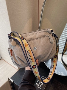 Gray nylon crossbody bag for women with multiple pockets and colorful floral wide strap