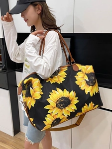 Large capacity black travel bag with sunflower print and leather handles for women