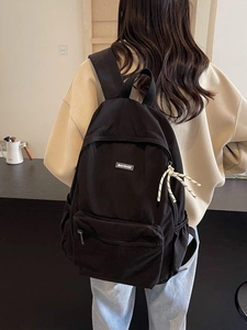 Lightweight black large capacity backpack with MACHUGE label for school students