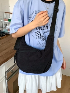 Versatile black crescent crossbody bag with adjustable wide strap for daily casual commuting