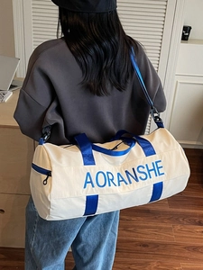 Large capacity duffel bag for gym and travel featuring a stylish two-tone blue and cream design