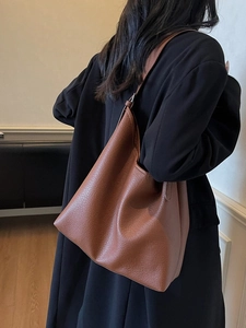 Classic caramel brown leather tote bag for women with minimalist retro pebble texture design