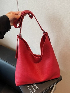 Large red pebbled leather hobo tote bag with adjustable shoulder strap and spacious interior