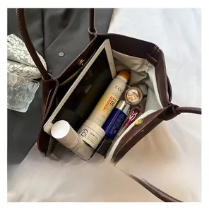 Top view of a dark brown pebble leather tote bag showing large capacity for daily essentials