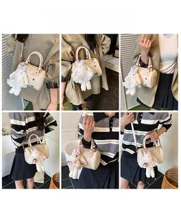 Boston bag with colorful patterns and plush rabbit charm shown on models in various outfits