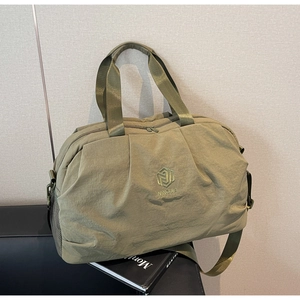Detailed embroidery logo on olive green waterproof nylon travel and fitness bag