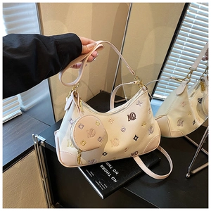 Detail of creamy white dumpling bag with colorful letter embroidery and coin purse