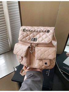 Quilted light pink leather backpack with chain detail and metallic clasp closure