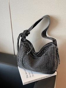 Large dark grey denim hobo tote bag with knotted strap and outer pocket for daily use