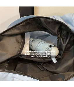 Detail of the inner dry-wet separation waterproof pocket inside this light blue travel bag