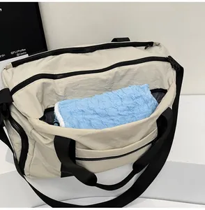 Detail of dry and wet separation interior in beige travel bag for toiletries