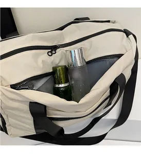 Detail of waterproof travel bag featuring a transparent dry and wet separation compartment