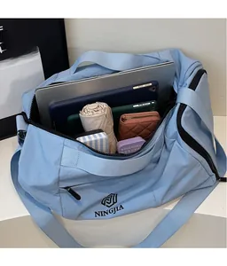 Interior view of large capacity travel bag showing storage for laptop and umbrella