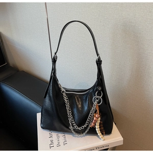 Black leather hobo bag featuring silver chain straps and colorful bead charms details