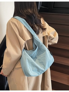 Minimalist light blue crescent canvas tote bag with large capacity for daily casual use