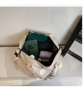 Detailed top view of large travel bag interior showing spacious compartments for gadgets