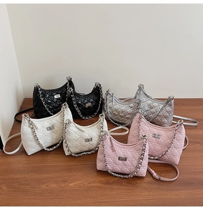 Quilted chain bucket bags shown in black, silver, white and pink color options