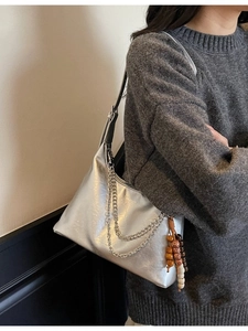 Silver metallic shoulder bag with double chain and colorful wooden bead charms