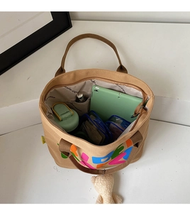 Top view of large canvas tote bag interior showing spacious storage and inner pockets