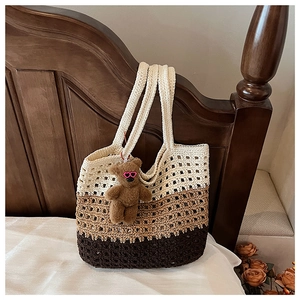 Detailed close-up of handmade crochet tote bag featuring tri-color gradient woven patterns