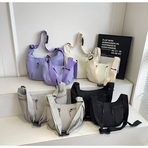 Detailed display of lightweight nylon dumpling bags in four colors with adjustable straps