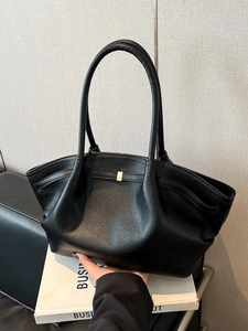 Black pebbled leather tote bag with long handles and gold square buckle for women