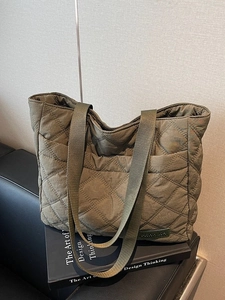 Army green quilted nylon tote bag with rhombus pattern and long canvas shoulder straps