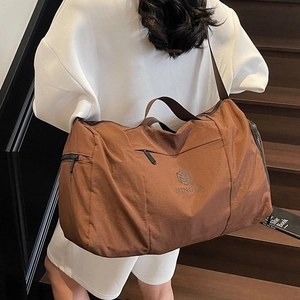 Brown canvas travel tote bag with large capacity for sport and short weekend trips