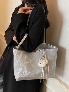 Silver metallic crinkled tote bag for women with plush bear charm and large capacity