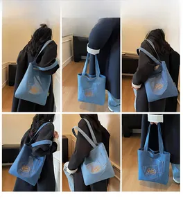 Multi-angle view of blue denim tote bag with orange embroidery and interior pockets