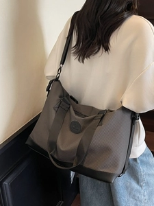 Deep grey woven large capacity travel tote bag with reinforced black leather bottom panel