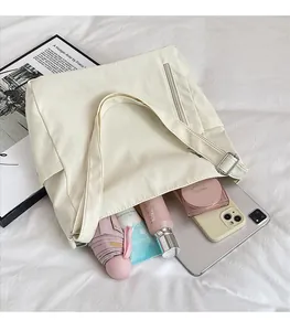 Macro shot of large capacity canvas tote bag showing interior storage for daily items