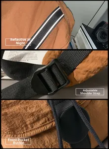 Detalle de mochila de nailon marrón con tiras reflectantes y correas ajustables