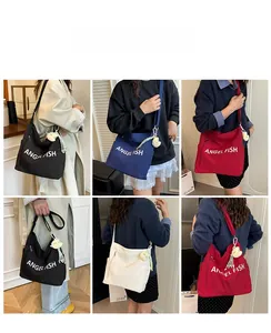 Collage of canvas tote bags in four colors with adjustable straps and fish pendants