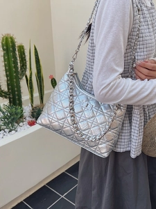 Quilted silver chain shoulder bag with metal turn-lock and metallic wrinkled finish