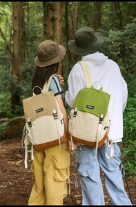 Detail of color-block waterproof outdoor backpacks with adjustable side buckles and fashion tags
