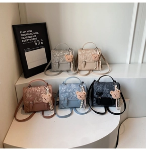 Group display of floral jacquard mini bags in five colors with cute bear charms